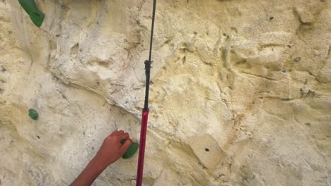 indoor-rock-climbing-pov-helmet-on-a-cruise-in-Singapore-sports-safety-line-rope-sportsman-hand