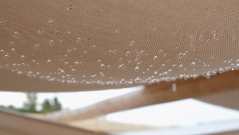 textile shed with falling raindrops