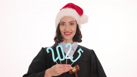 judge in santa hat holding 2025 numbers and gavel
