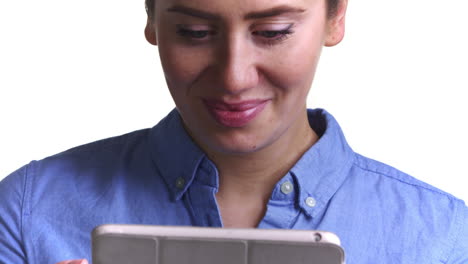 Shot-Of-Woman-Using-Digital-Tablet-Against-White-Background