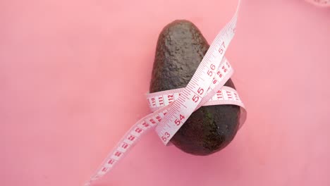 avocado with measuring tape