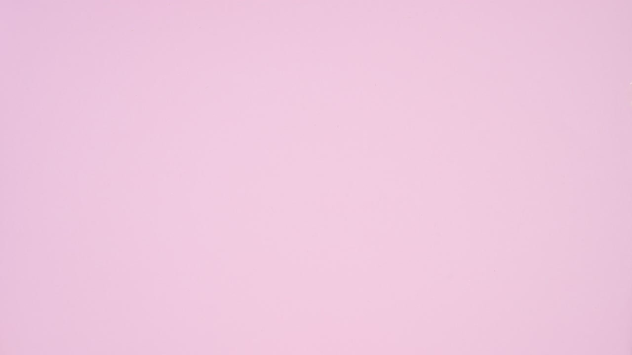 Christmas sweets, cupcakes and gingerbread cookies with gifts and ornament on pastel pink theme. Stop motion