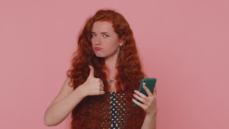 Redhead-girl-using-mobile-phone-typing-post-on-web-sms-message-browsing-addiction-of-social-networks