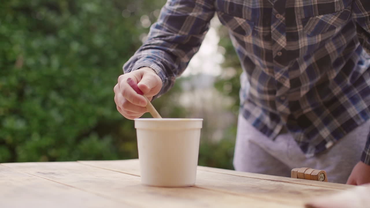 Painting a Wooden Table Outdoors