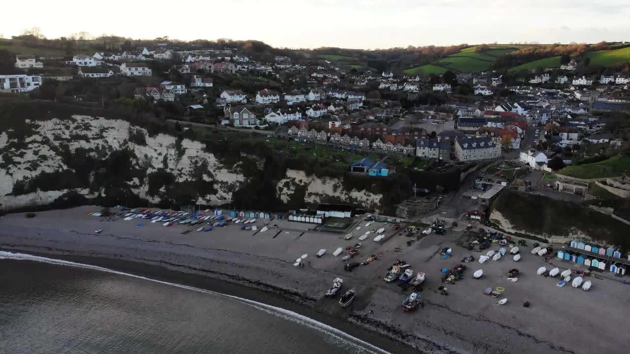 Aerial View of Coastal Town with Beach and Boats