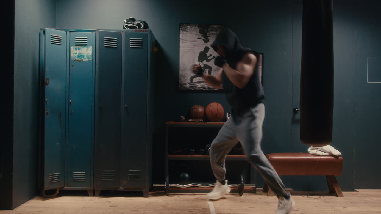 Man Boxing Training in a Gym Locker Room