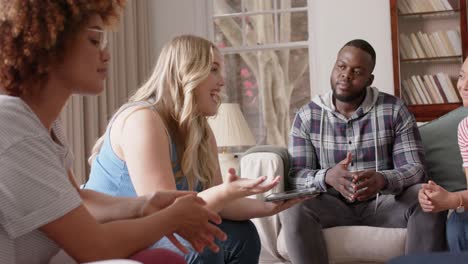 diverse friends talking and using tablet at group therapy, slow motion