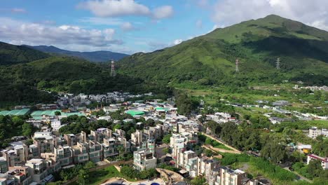 aerial of sheung shui district with luxury housing complex in hk countryside