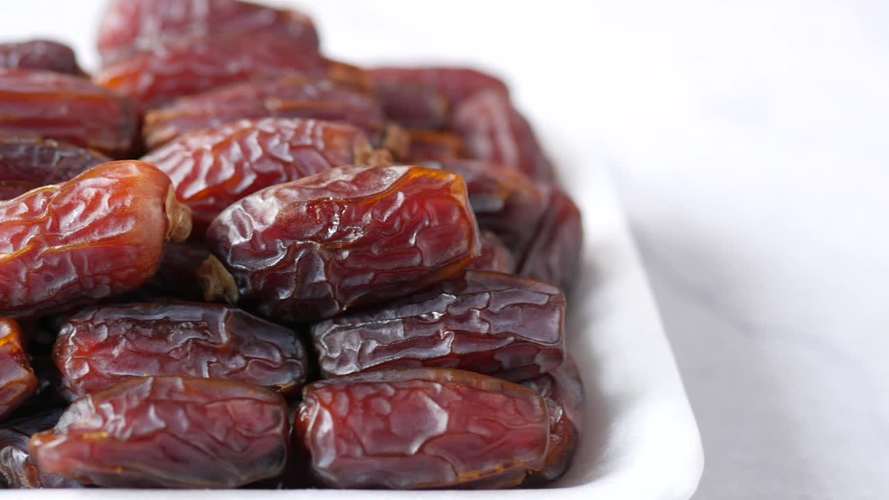 close up of fresh date fruit in a bowl on table