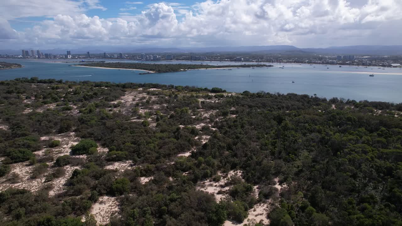 South Stradbroke Island's Sandy Bushland With Wave Break Island And Distant Skyline In Background. wide aerial shot