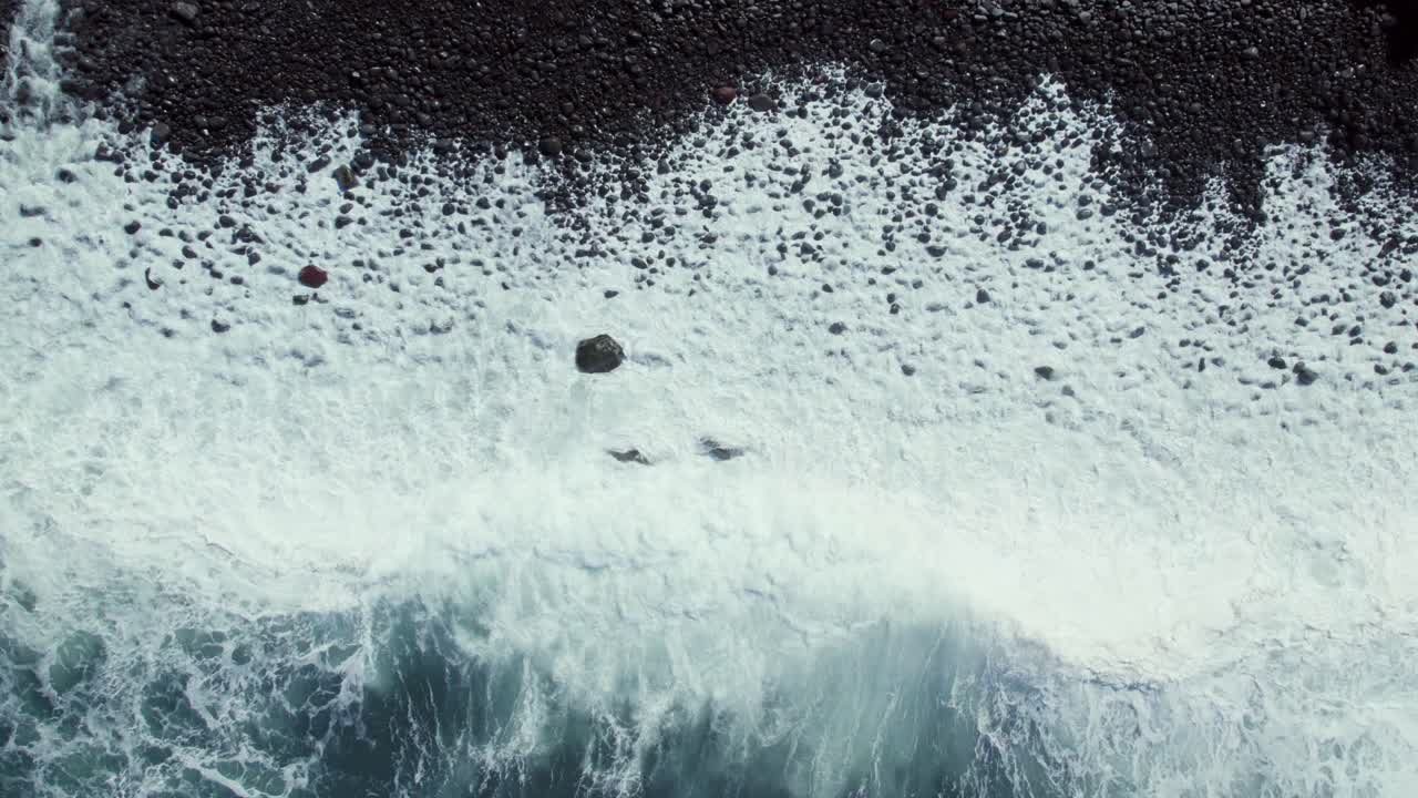 Ocean Waves Crashing on a Volcanic Black Sand Beach