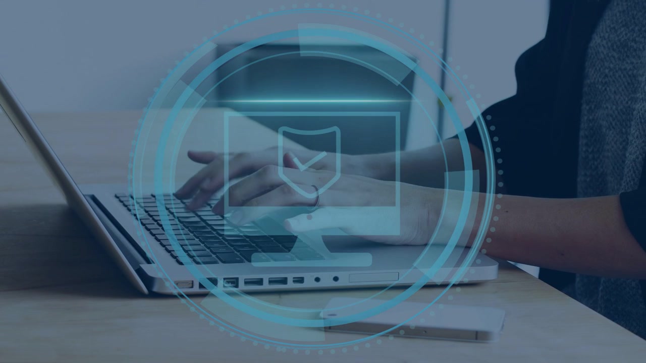 Mid-adult woman placing hands and typing on laptop, activating Cyber Security HUD scanning shield