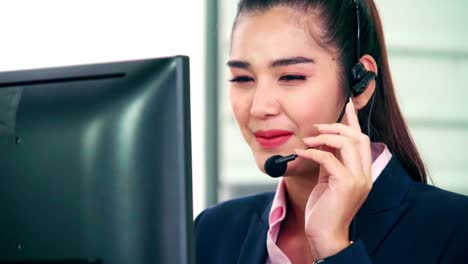 Business-people-wearing-headset-working-in-office