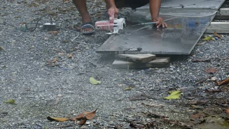 man cutting granite stone