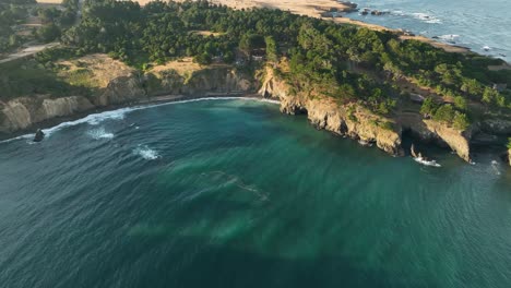 orbiting aerial view of a protected cove on california's northern coastline