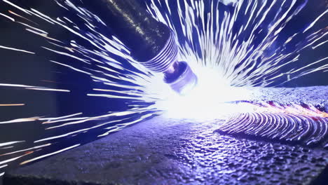 industrial welding process with sparks and fumes