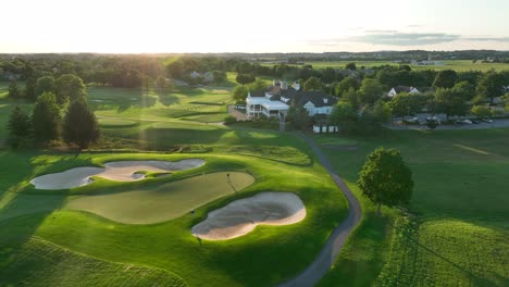 Golfers-on-country-club-golf-green