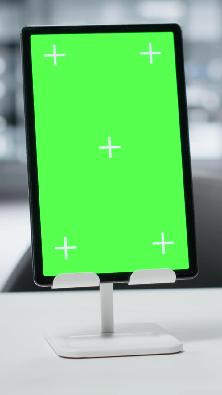 Vertical video Green screen tablet on laboratory workbench, close up