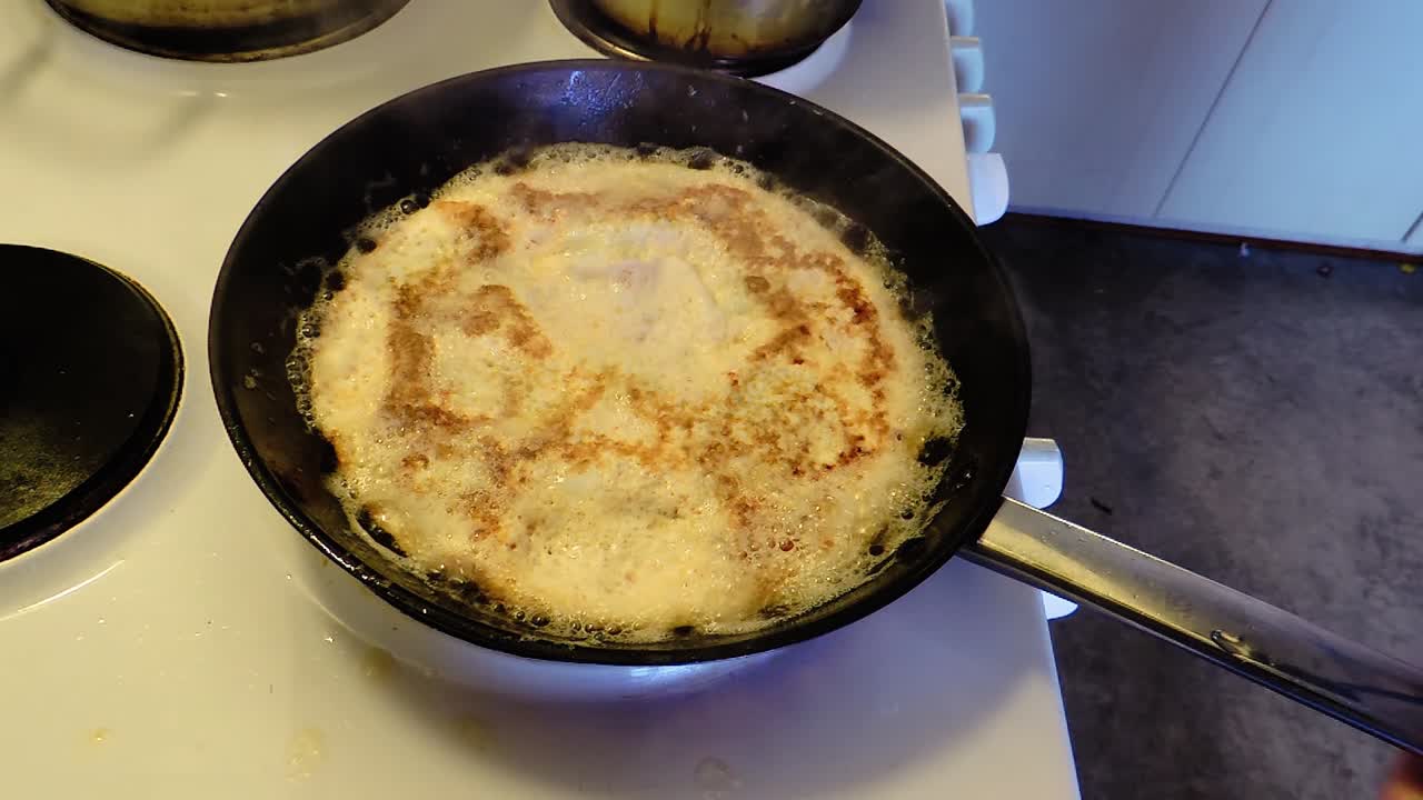 Frying Omelet Flipping it Over on the Pan - Steady Shot