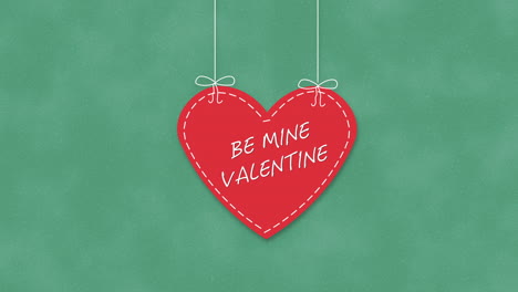 Animated-closeup-Be-Mine-Valentine-text-and-motion-romantic-big-red-heart-on-Valentines-day-background