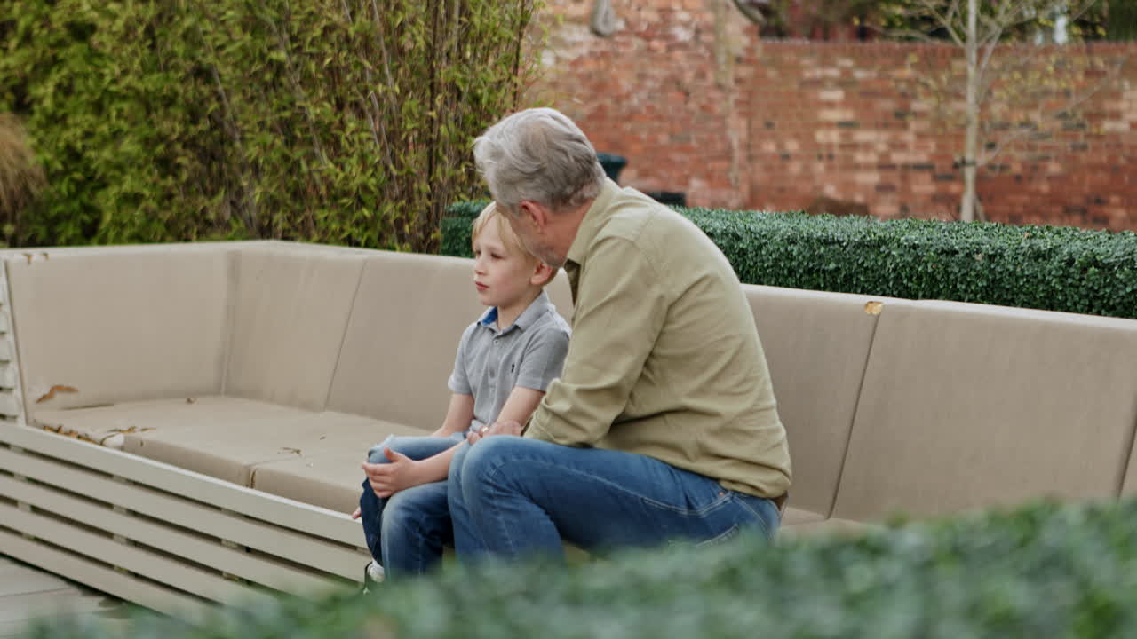 Grandfather and Grandson on Park Bench