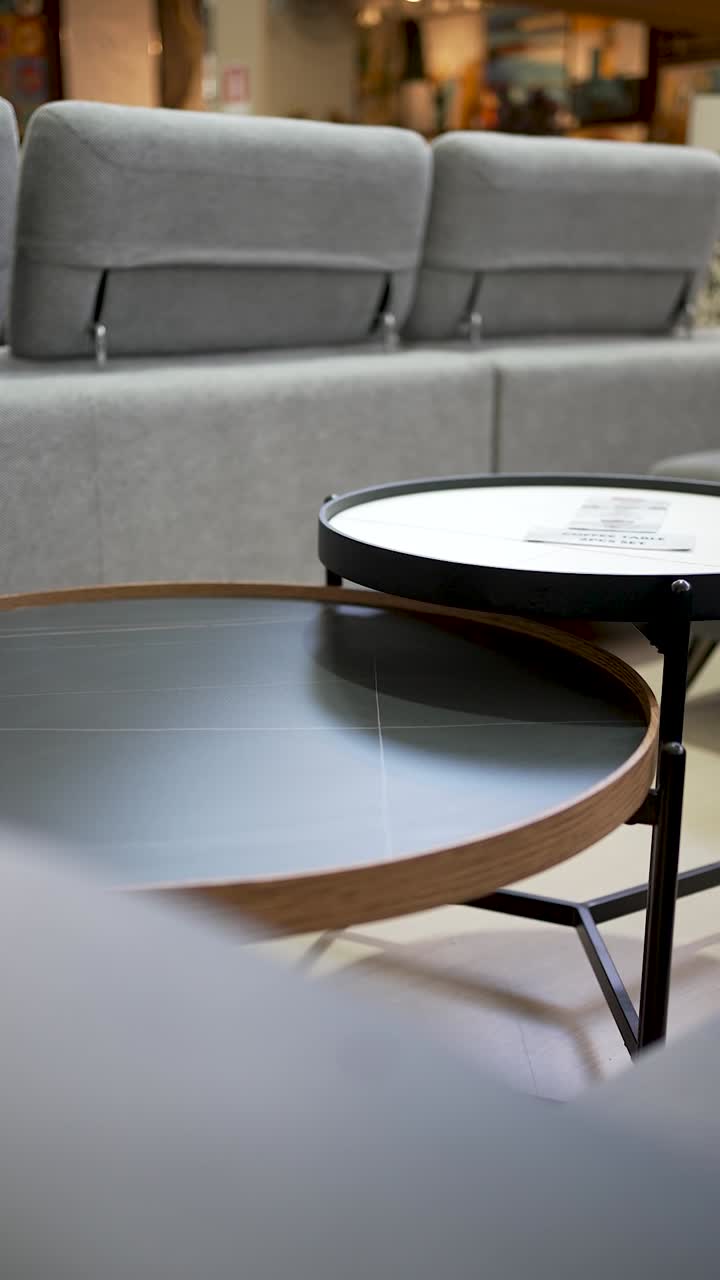 Explore a modern furniture display featuring round tables designed with ...