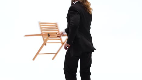 man in a black suit and fedora with a cigarette on a white background