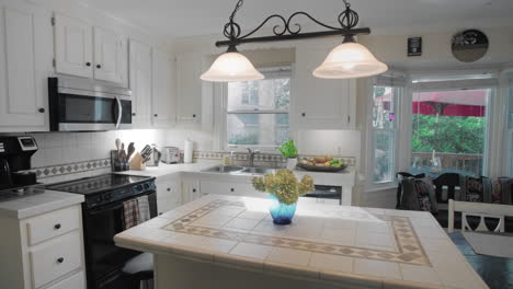 gimbal shot of and empty white kitchen in the suburbs