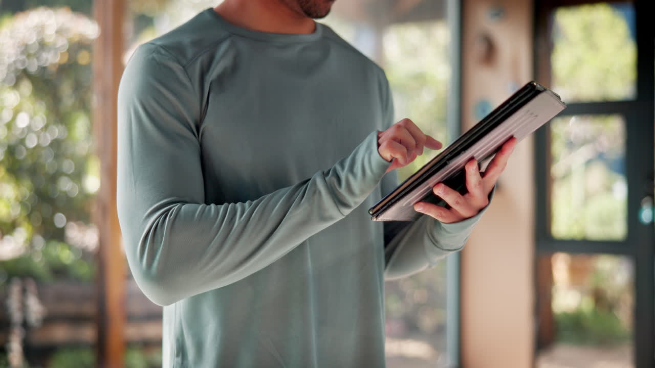 Man using a tablet at home
