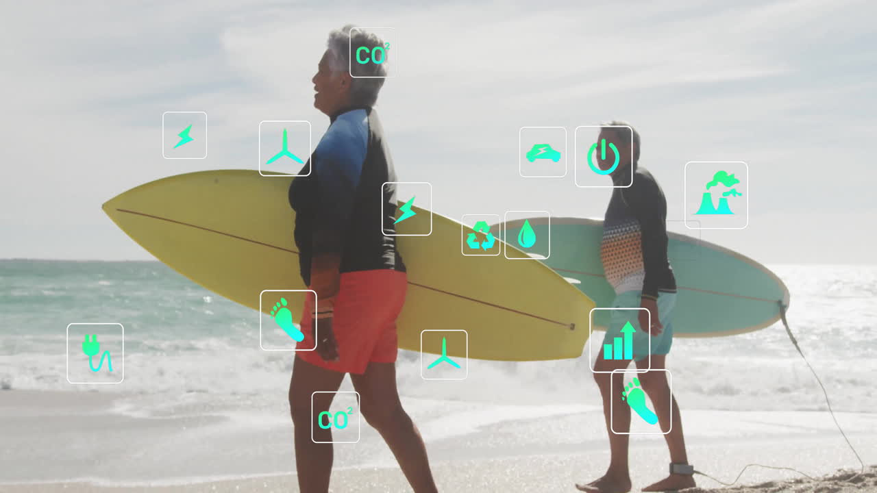 Couple walking barefoot on shore with surfboards, floating green eco icons showing renewable energy