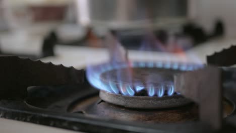 light a gas cooker, blue gas ignites frames in kitchen