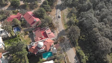 drone shot , zenithal aerial view of a road in a residential area