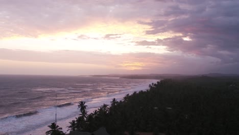 Aerial-view-of-San-Andres,-Colombia,-showcasing-the-beach,-forest,-and-the-expansive-Caribbean-Sea-under-a-vast-and-captivating-sky