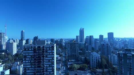 Davie-and-Broughton-flyover-towards-Burrard-newly-built-premium-condo-in-the-most-sought-after-neighbourhood-in-downtown-Vancouver-on-calm-sunny-blue-sky-clear-day-overlooking-the-post-modern-skylines