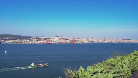historical capital of portugal, lisbon cityscape over the tagus river from almada in the daytime