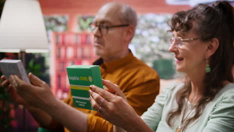 elderly people reading about pills and supplements on the boxes