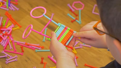 close view of a kid playing with creative toys