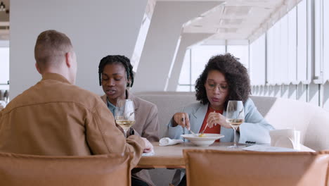 friends enjoying lunch in a modern restaurant