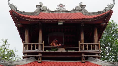 mesmerize and inspired by a view, young woman take pictures from a shrine temple