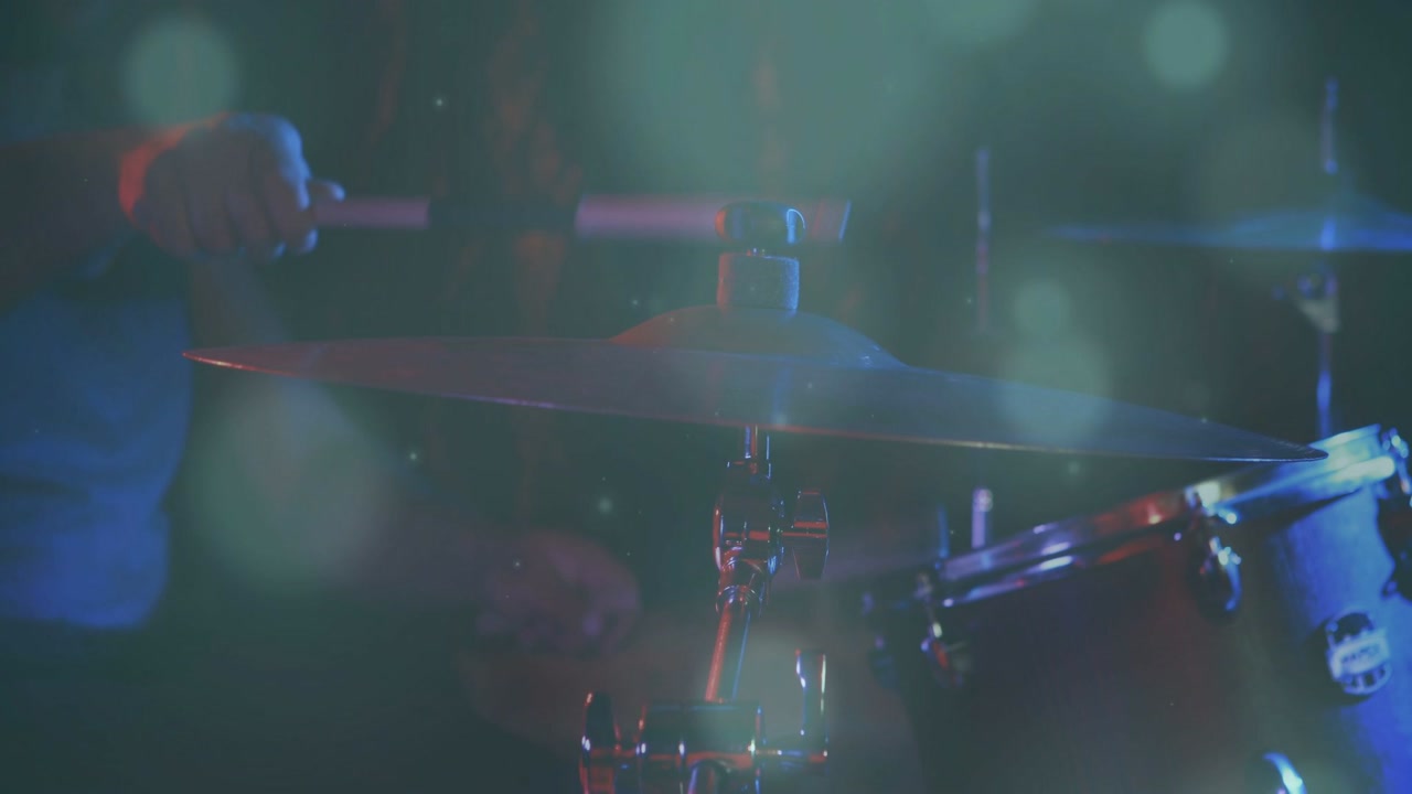 Drummer starting stick touching, striking cymbal and tom while animated wave overlaying light music