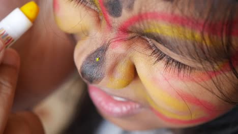 child getting face paint