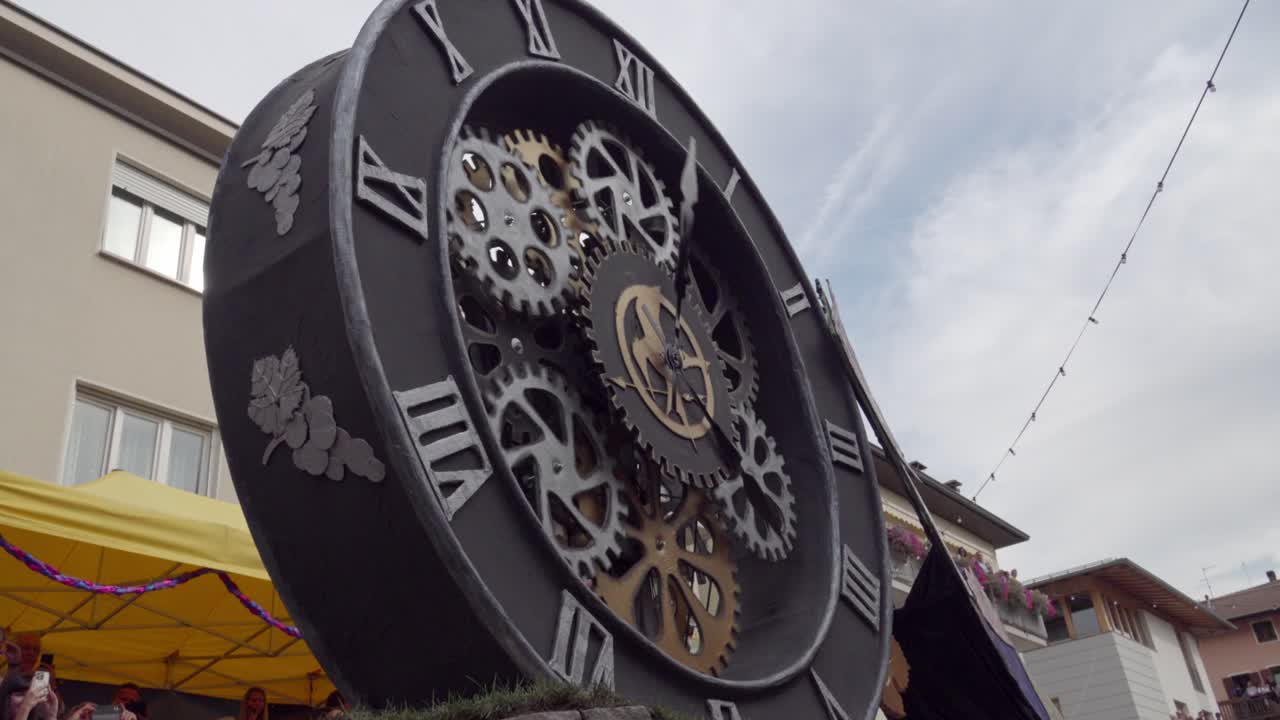 A huge clock with its visible clockwork at the annual Grape Festival, Verla di Giovo, Trentino, Italy