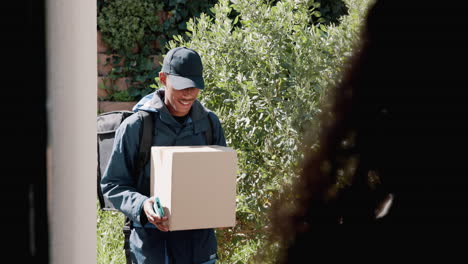 a delivery person smiles at a customer as he hands them a package