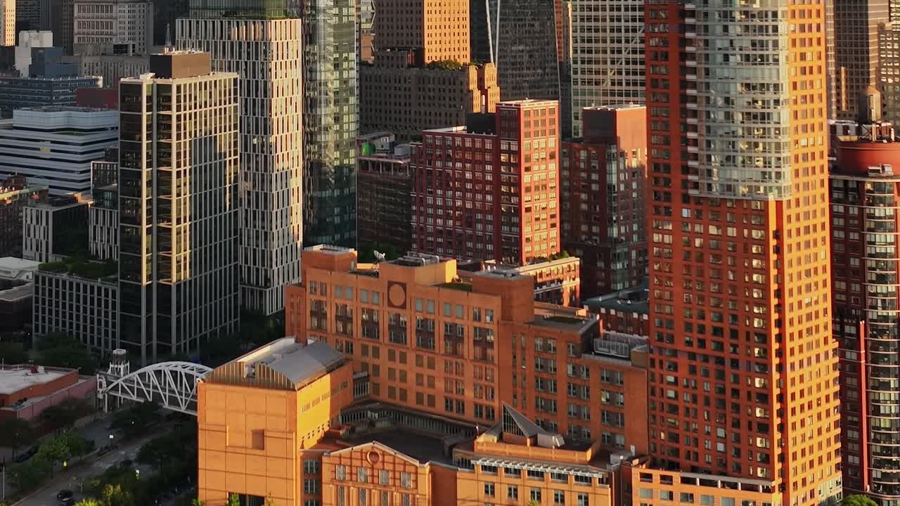 Sky view of colorful buildings in New York City during sunset