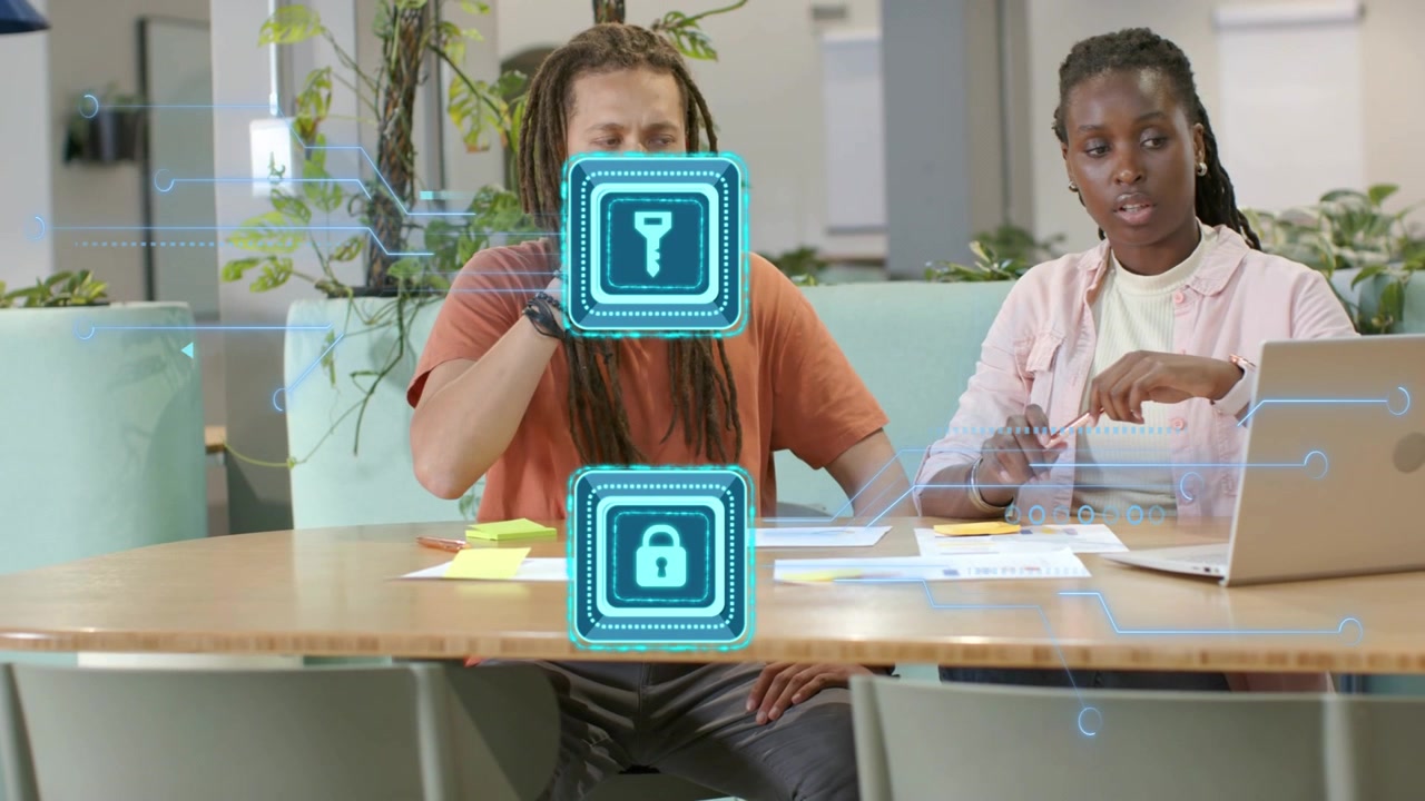 Two women team placing mug, pointing at papers in lounge, hologram key or lock appearing securing da