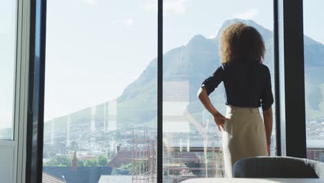 business woman thoughtful looking through the window