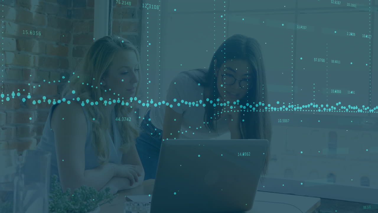 Data visualization animation over two women working on laptop in office