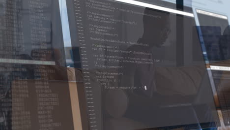 male developer typing on laptop in casual office, with animated code overlay scrolling