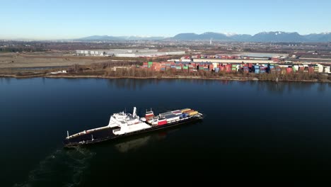 roll-on roll-off ferry at fraser river in delta, canada. - aerial shot