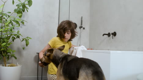 girl and dog at the bathroom